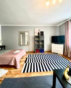 Cama o camas de una habitación en Apartament Przy Ratuszu | The Very Center
