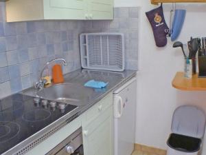 a small kitchen with a sink and a counter top at Appartement Samoëns, 2 pièces, 5 personnes - FR-1-629-68 in Samoëns