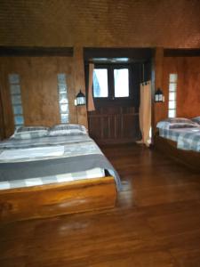Postel nebo postele na pokoji v ubytování Pai Kiniman Resort