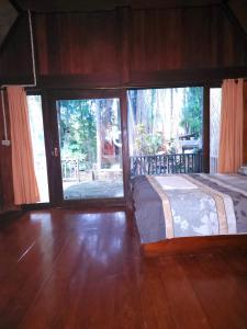 Postel nebo postele na pokoji v ubytování Pai Kiniman Resort