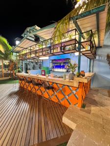 a bar on top of a deck at night at Coco Beach Hotel - Rooftop & Beach Club in Cartagena de Indias