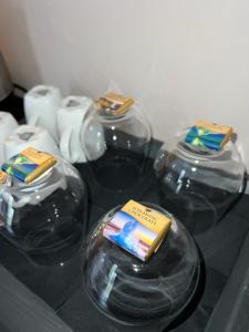 a group of four glass domes sitting on a counter at Bjork Guesthouse in Laugarvatn