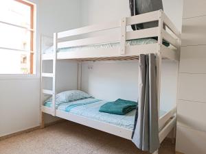 a bedroom with two bunk beds in a room at Daydream Medano Coliving in El Médano