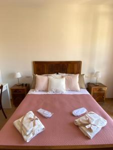Postel nebo postele na pokoji v ubytování Nonna Felicia B&B