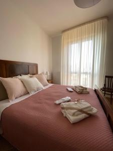 Postel nebo postele na pokoji v ubytování Nonna Felicia B&B