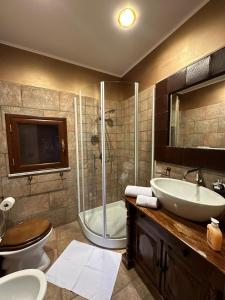a bathroom with a shower and a sink and a toilet at Casa vacanze bacio del sole in Palermo
