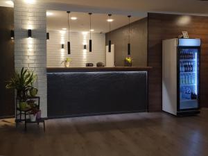 a bar with a refrigerator in a room at Rheinmetropole Hotel in Düsseldorf