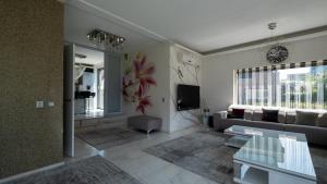 a living room with a couch and a tv at Big 5-bedroom house in Capelle aan den IJssel in Capelle aan den IJssel