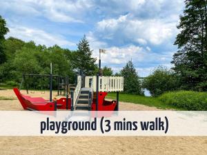 a playground mins walk in a park at Ferienhaus Wiesengeflüster W10 - mit Sauna, Kamin und Garten in Röbel