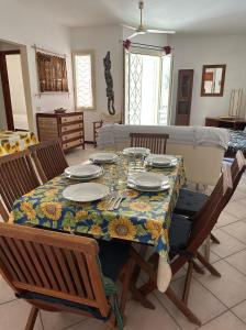 a dining room table with a floral table cloth on it at KatlantiK Estoril Deluxe in Sal Rei +15 photos