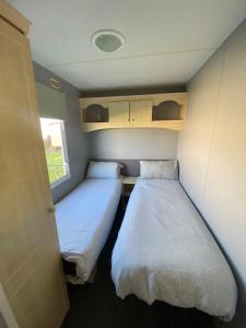 Voodi või voodid majutusasutuse Seaview 190 - Ingoldmells - Close to beach and Fantasy Island toas