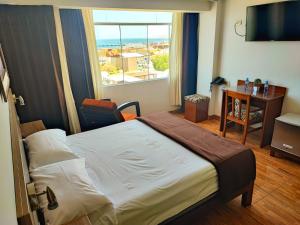 Ένα ή περισσότερα κρεβάτια σε δωμάτιο στο Torreblanca Hotel