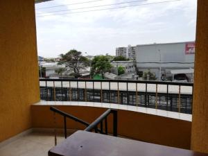 a balcony with a table and a view of a city at APARTAESTUDIO LA 27 in Barranquilla
