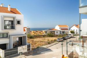 a view from the balcony of a house at Beach, Ocean view & Bright House Ericeira in Ericeira
