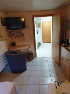 TV a/nebo společenská místnost v ubytování B & B Buchhorst 21481