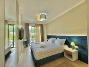Postel nebo postele na pokoji v ubytování Comfort Apartments Pasha