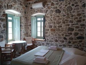 Кровать или кровати в номере Casa Mar on Kantouni Beach