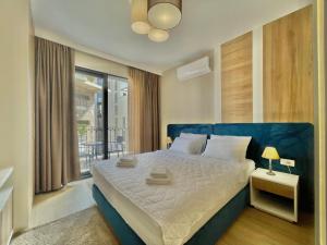 Postel nebo postele na pokoji v ubytování Comfort Apartments Pasha