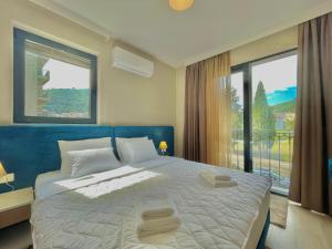 Postel nebo postele na pokoji v ubytování Comfort Apartments Pasha