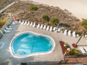an overhead view of a swimming pool next to the beach at Beachfront Madeira Norte in St Pete Beach