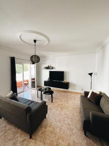 Et tv og/eller underholdning på Alvor Apartment