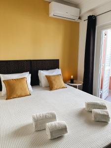 a bedroom with a large bed with two pillows at Alvor Apartment in Alvor