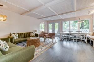 a living room with a couch and a table at Family chalet in the heart of Wakefield in Wakefield