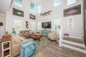 a living room with a couch and a table at Tranquil Tarpon Cottage in St Pete Beach