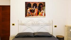 Postel nebo postele na pokoji v ubytování Art Suites Verona