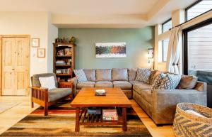 a living room with a couch and a table at Village Point 101 in Breckenridge