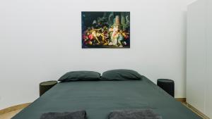 Postel nebo postele na pokoji v ubytování Art Suites Verona