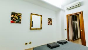 Postel nebo postele na pokoji v ubytování Art Suites Verona