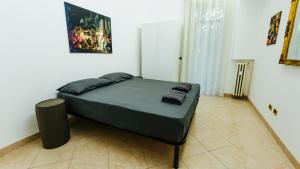 Postel nebo postele na pokoji v ubytování Art Suites Verona