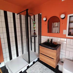 a bathroom with a shower and a sink at Merchant House in Bootle