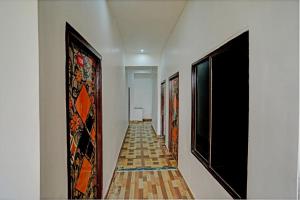 a hallway with paintings on the walls of a building at Hotel Starlight in Lucknow