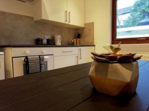 a kitchen with a vase sitting on a table at Black Sheep Bunkhouse in Fort William