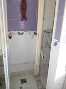 a bathroom with a shower and a shower at Dar manena in Kairouan
