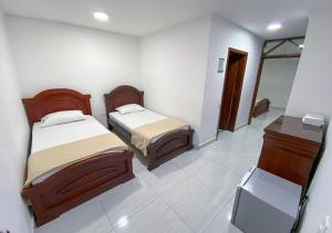 Postel nebo postele na pokoji v ubytování Hotel Exelsior