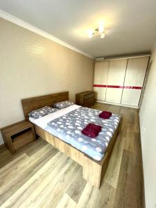 a bedroom with a large bed in a room at Chornovola Apartment Липинського 28 in Lviv