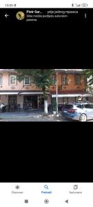 a picture of a car parked in front of a building at Restoran Ruža in Jablanica