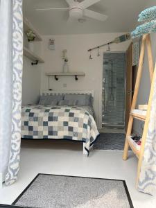 A bed or beds in a room at The Whitstable, Tankerton Bolt Hole