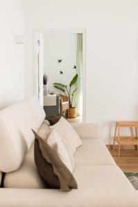 En eller flere senge i et værelse på Cegonha Branca Beach Flat + 19 billeder