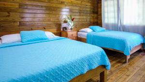 Ein Bett oder Betten in einem Zimmer der Unterkunft Hospedaje Yarisnori