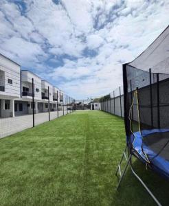 a basketball court with a net in the middle of a field at Luxury Shortlet Apartment LBS, AJAH in Lagos