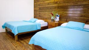 Cama ou camas em um quarto em Hospedaje Yarisnori