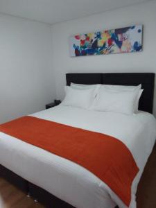 Postel nebo postele na pokoji v ubytování Hotel Portal de los Andes