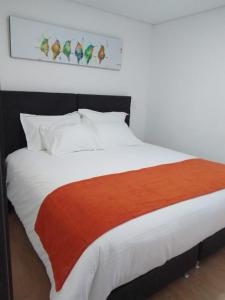 Postel nebo postele na pokoji v ubytování Hotel Portal de los Andes