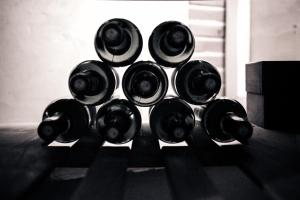 a bunch of bottles sitting on a table at Les Ecuries de la Tour in Mondonville