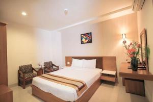 Postel nebo postele na pokoji v ubytování Bunny - Valentine Hotel - Bui Vien Street