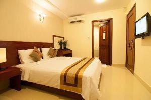 Postel nebo postele na pokoji v ubytování Bunny - Valentine Hotel - Bui Vien Street + 37 fotografií